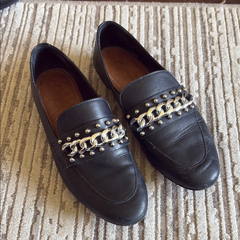 L’Intervalle Black Leather Loafers with Silver Chain Detail